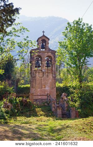 Separate Belfry  On The Background Of The Mountain.    Montenegro, Prcanj Town,  Birth Of Our Lady C