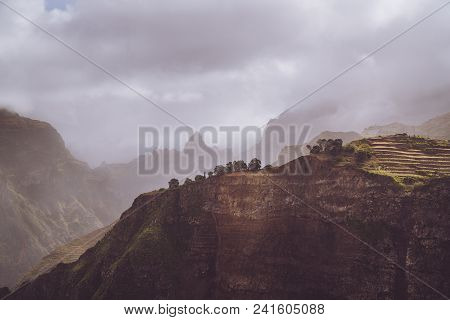 Scenery With Shape Of Huge Rocks And Motion Clouds Mist On Sky. Surreal Moment Before A Thunderstorm