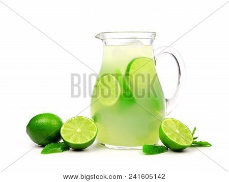 Jug Of Summer Limeade With Limes And Mint Isolated On A White Background