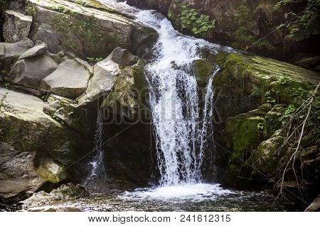View Of Kamianetskyi Waterfall Is Located On The Kamianka River (a Right Tributary Of The Opir River