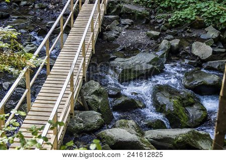 Wooden Footbridge At The Kamianka River (a Right Tributary Of The Opir River) Near The Kamianetskyi 