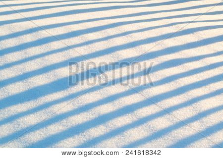Shadows In The Snow Along The Diagonal From Edge To Edge, Snow And Shady Stripes