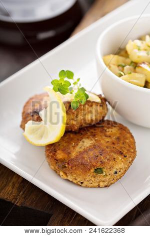 Crab Cakes With A Side Of Potatoes