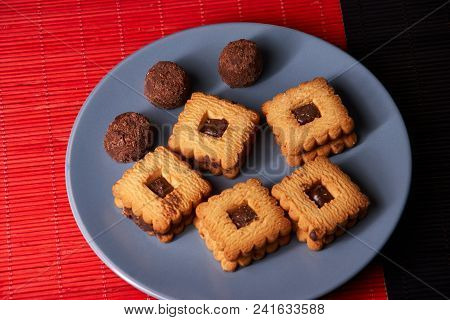 Stacked Chocolate Chip Cookies On Gray Style Plate