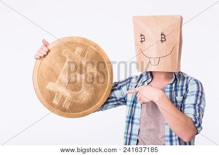 Golden Bitcoin In A Man Hand, Digitall Symbol Of A New Virtual Currency