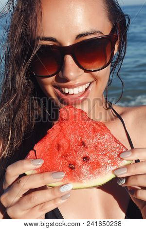 Summer Vacation - Young Girl Eating Fresh Watermelon On Sandy Beach