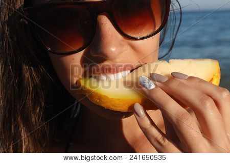 Summer Vacation - Young Girl Eating Fresh Watermelon On Sandy Beach