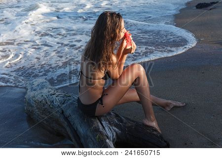Summer Vacation - Young Girl Eating Fresh Watermelon On Sandy Beach