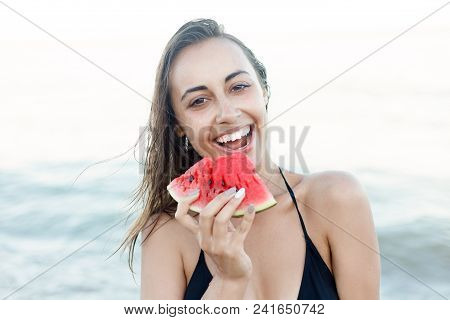 Summer Vacation - Young Girl Eating Fresh Watermelon On Sandy Beach