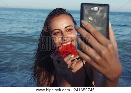 Summer Vacation - Young Girl Eating Fresh Watermelon On Sandy Beach