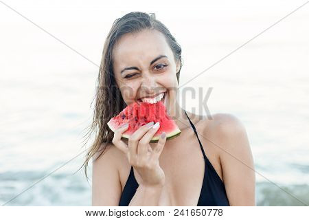 Summer Vacation - Young Girl Eating Fresh Watermelon On Sandy Beach