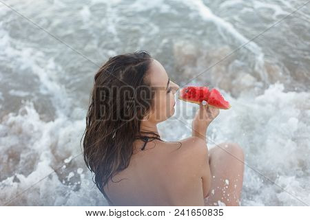 Summer Vacation - Young Girl Eating Fresh Watermelon On Sandy Beach