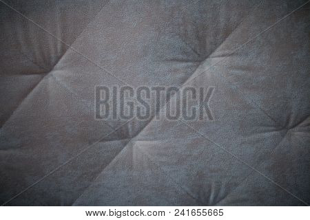 Leather Sofa Texture Seamless Background, Gray Upholstery Sofa With Dents.