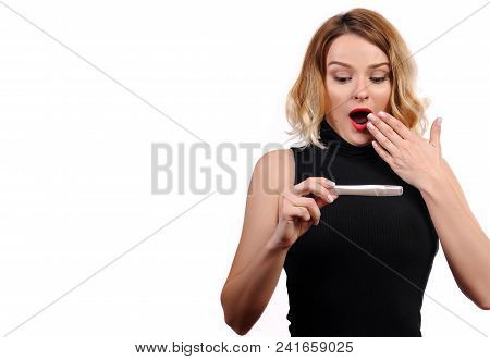 Shocked  Happy Woman Showing A Positive Pregnancy Test.