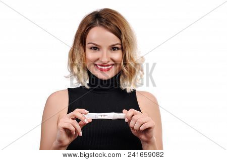 Happy Woman Showing A Positive Pregnancy Test