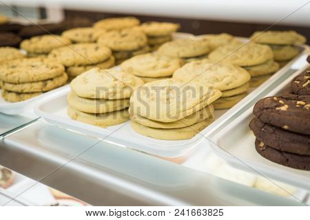Artisanal Cupcakes And Cookies At A Bakery On Display