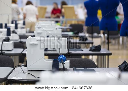 Nterior Of Garment Factory Shop. Closes Making Atelier With Several Sewing Machines. Tailoring Indus
