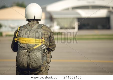 One Police Aerial Reinforcement Unit In Camouflage Uniform And Helmet With T-10 Static Line Parachut