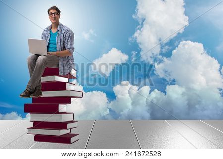 Young man in telelearning concept with laptop and books