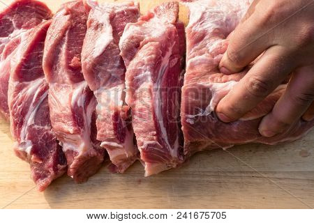 Overhead View Of Raw Piece Of Pork On Wooden Background. Piece Of Fresh Boneless Pork, Neck Part Or 