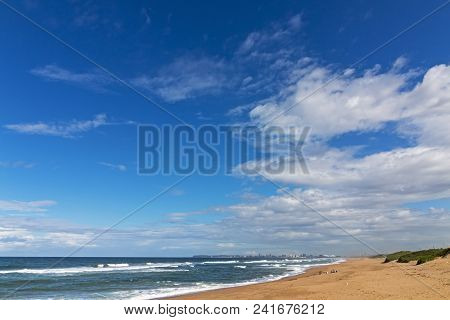 Llarge Blue Cloudy Sky And Distand City Coastal Skyline