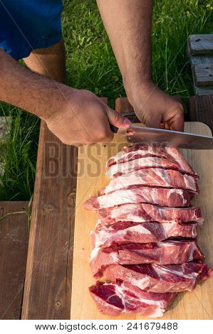 Overhead View Of Raw Piece Of Pork On Wooden Background. Piece Of Fresh Boneless Pork, Neck Part Or 