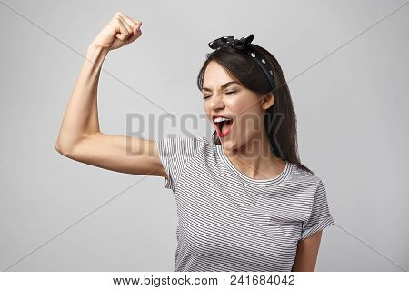 Picture Of Excited Young Brunette Woman In Casual Clothes Opning Mouth Widely While Screaming, Showi