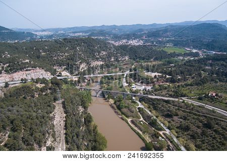 Llobregat River. Aerial View. Bridges And Fields