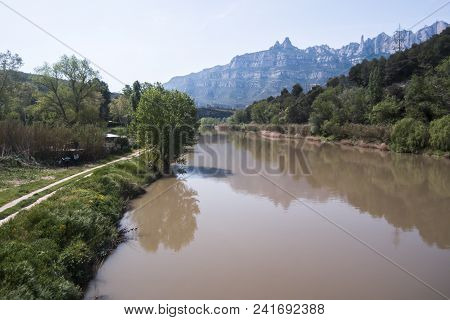 Llobregat River. Barcelona. Montserrat Mountain Background. Aerial View