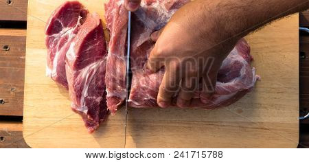 Overhead View Of Raw Piece Of Pork On Wooden Background. Piece Of Fresh Boneless Pork, Neck Part Or 