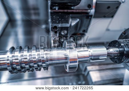 Metalworking CNC milling machine. Cutting metal modern processing technology. Small depth of field. Warning - authentic shooting in challenging conditions. A little bit grain and maybe blurred.