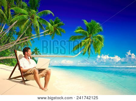 Businessman working remotely from a beach
