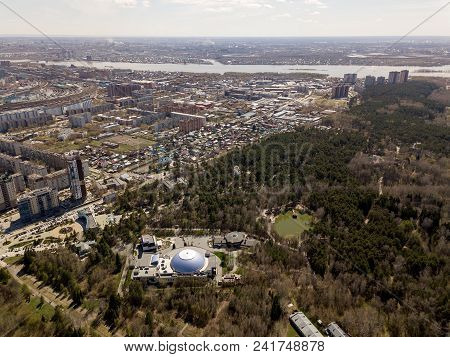 Forest In The Novosibirsk City,siberia With Diffrent Trees And Plants With Some Buildings In It. Str