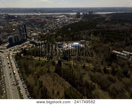 Forest In The Novosibirsk City,siberia With Diffrent Trees And Plants With Some Buildings In It. Str