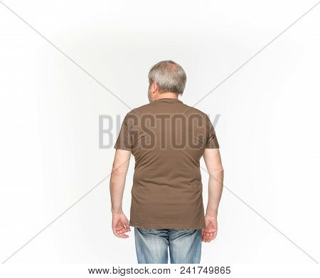 Closeup Of Senior Man's Body In Empty Brown T-shirt Isolated On White Background. Mock Up For Disign