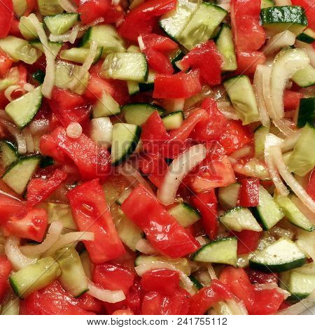 Fresh Salad With Tomato Cucumber And Onion Dressed With Olive Oil