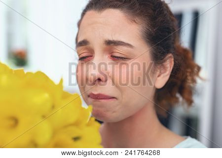 Range Of Mishaps. Young Sad Looking Lady Having Her Eyes Closed Biting Her Lip Being On The Edge Of 