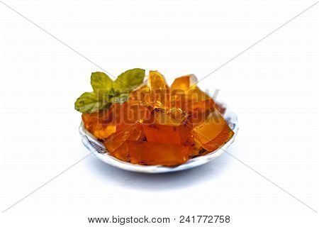 Orange Colored Halwa Grass Or China Grass Or Jelly In A Plate With Mint Leaves A Sweet Dessert Eaten