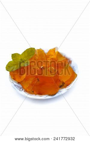 Orange Colored Halwa Grass Or China Grass Or Jelly In A Plate With Mint Leaves A Sweet Dessert Eaten