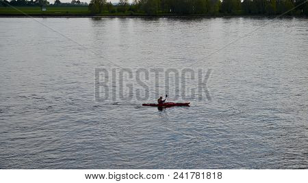Emmerich Am Rhein, Germany - April, 27, 2018, Kayak Floats Down On The River, Editorial.