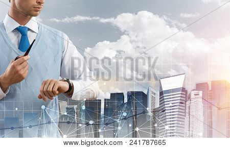 Double Exposure Of Confident And Young Businessman In Smart-casual Wear Smoking Pipe And Modern City