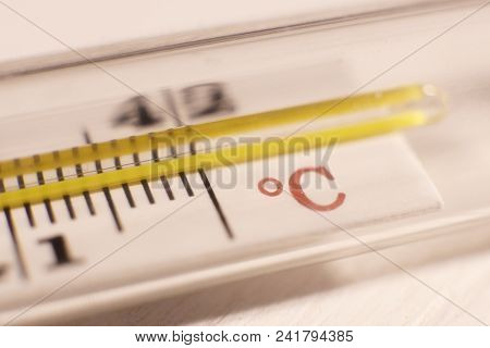 Thermometer Cesium Temperature Symbolic Background. Macro Closeup.