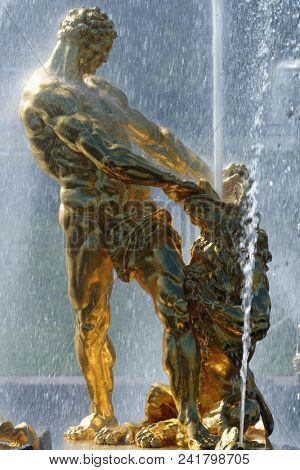 PETERHOF, ST. PETERSBURG, RUSSIA - MAY 10, 2018: Golden statues of the Grand Cascade. The cascade was built in 1715-1724 and is one of the remarkable fountain constructions in the world