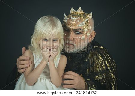 Little Blond Smiling Angel In White Outfit Embraced By Monster With Dragon Skin And Thorns. Good Vs 