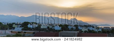 Dawn In Summer Over The City In The Mountains With Hanging Clouds On The Horizon At Sea. Turkey, Ala