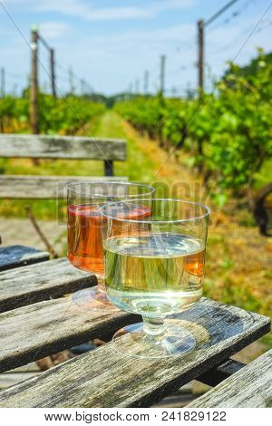 White And Rose Wine Served On Green Vineyard