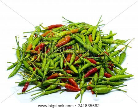 Beautiful  Top View , Small And Red Hot Bird Eye Chili Padi , Isolated On A White Background.