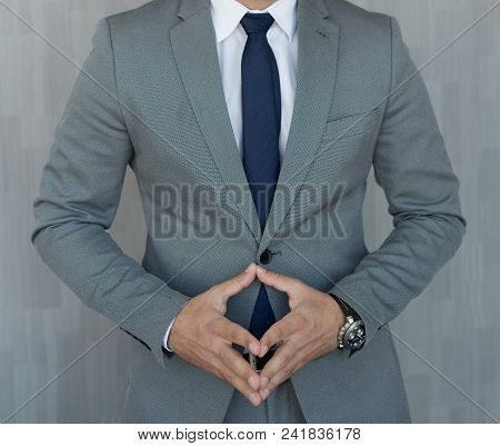 Torso Of Anonymous Businessman Standing With Hands In Lowered Steeple Wearing Beautiful Fashionable 