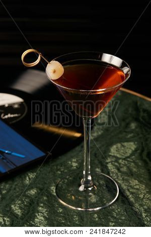 Vinyl Manhattan Cocktail On Bar Table. Freshness Alcoholic Beverage Drink With Whiskey, Rosso, Roseh