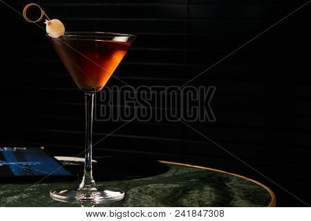 Vinyl Manhattan Cocktail On Bar Table. Freshness Alcoholic Beverage Drink With Whiskey, Rosso, Roseh